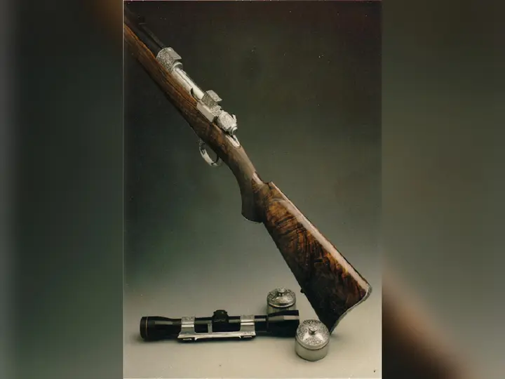 Bicentennial rifle left side with scope mount and oil bottles